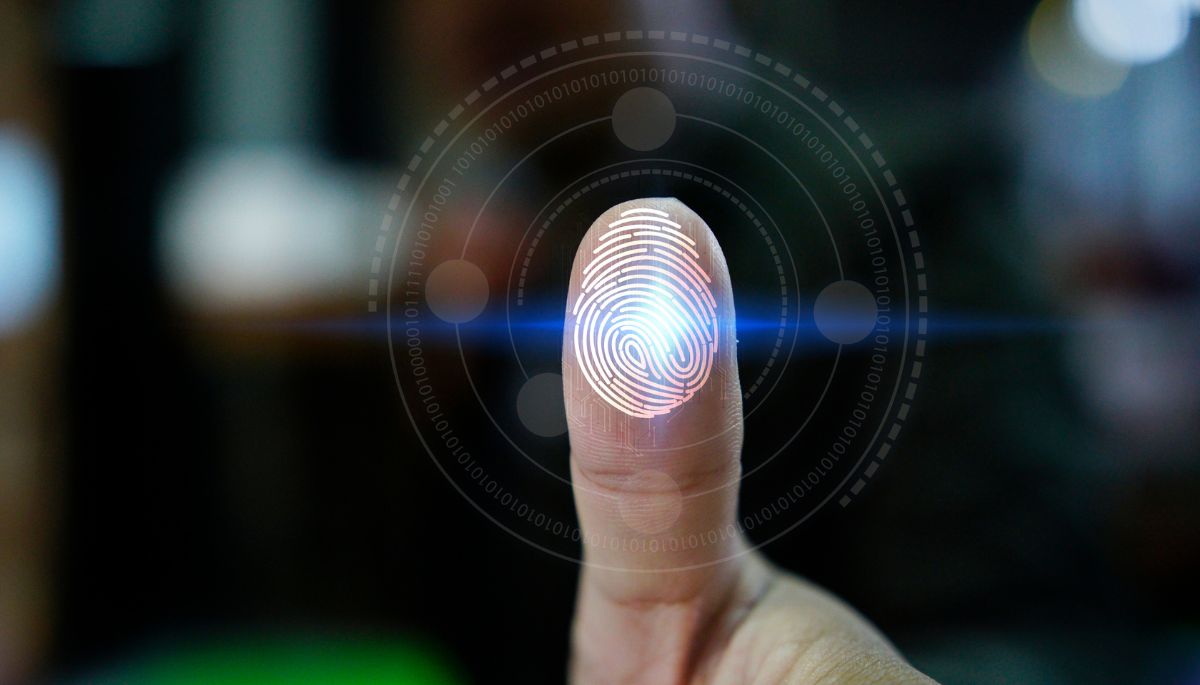 Close-up of a fingertip with a bright fingerprint overlay and circular biometric scan rings, suggesting fingerprint authentication.